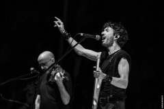 Luca Zabbini on stage with a bandmate, black and white live photo