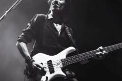 Luca Zabbini playing electric guitar with PFM, black and white